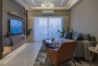 Living room with orange sofa and wooden partition